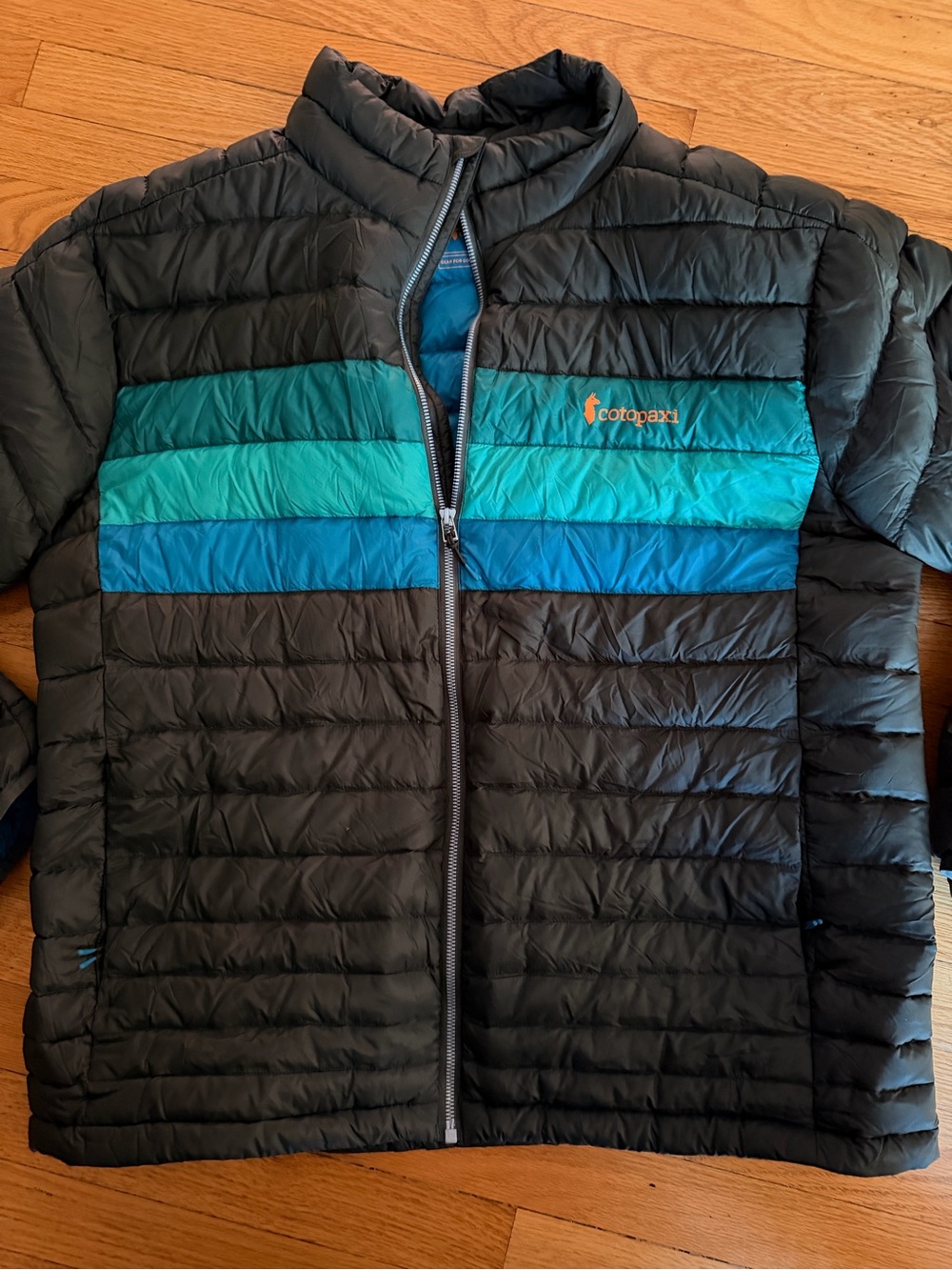 cotopaxi Black Puffer Jacket with Teal & Blue Stripes men’s XL new